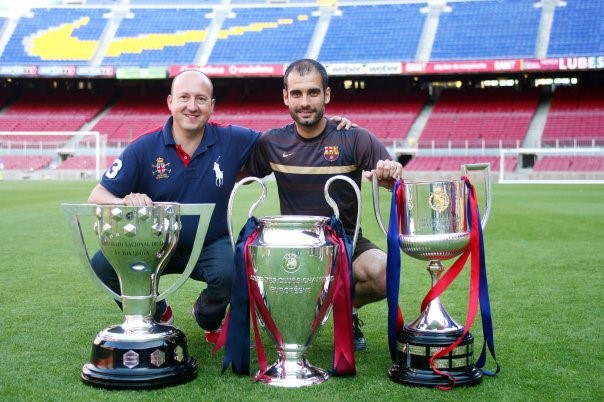SGL Area Manager Xavi Tordera with Pep Guardiola and cups at the Camp Nou stadium