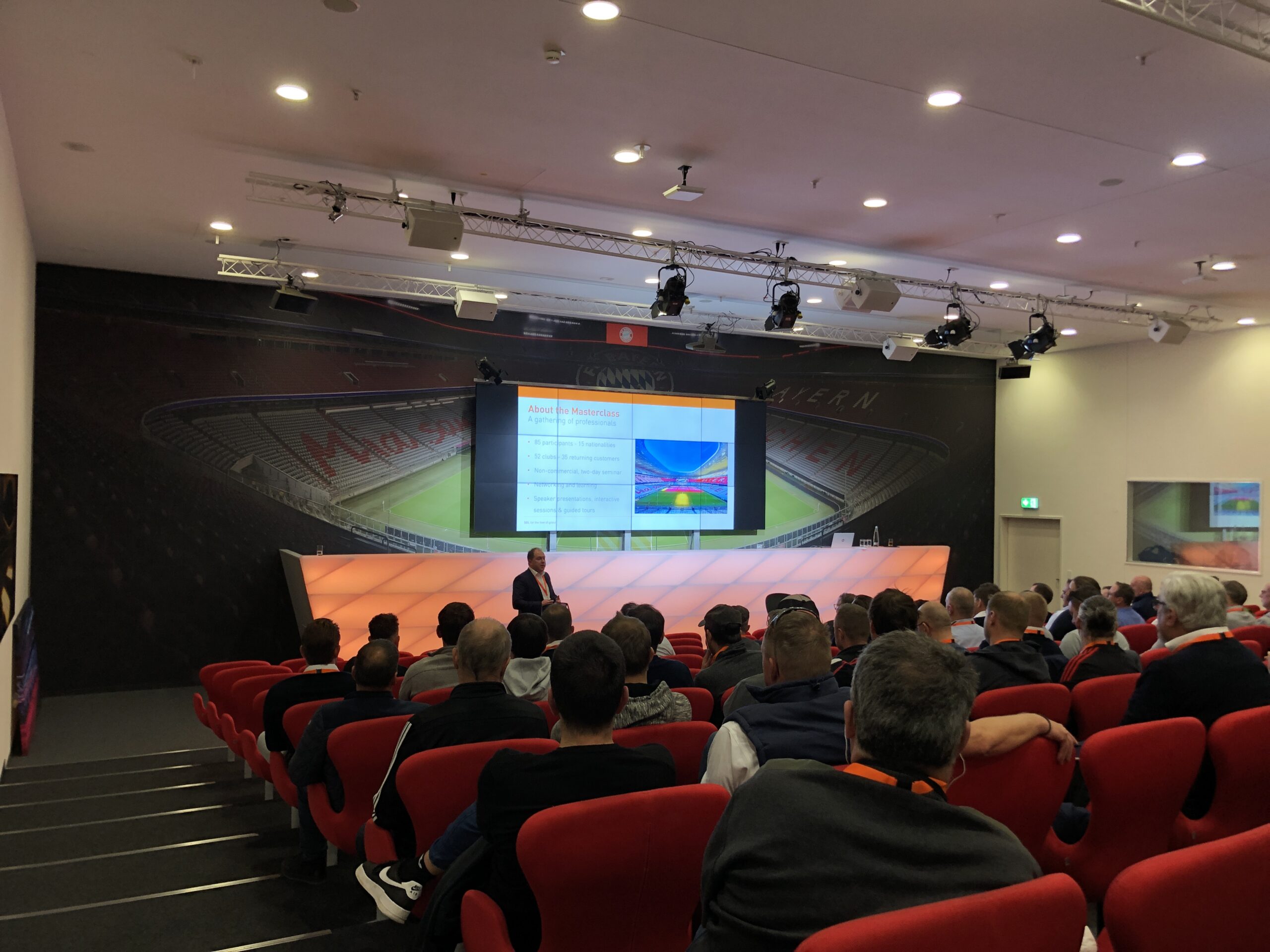 Masterclass attendees in the Allianz Arena press auditorium listening to a presentation from SGL.