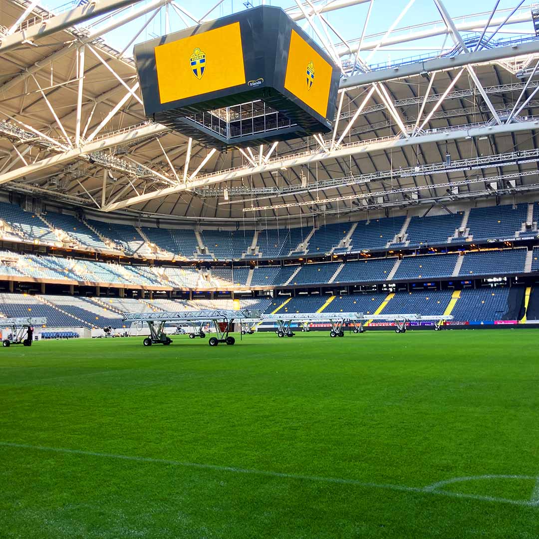 The enclosed roof structure of the Friends Arena with the SGL LED440 folded on the pitch.