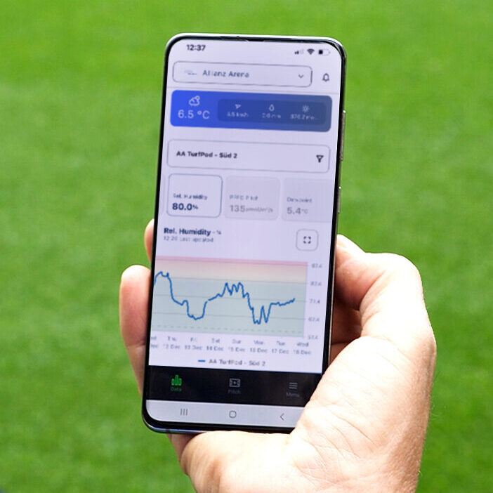 A groundsman uses TurfBase to check the growth data of his pitch.